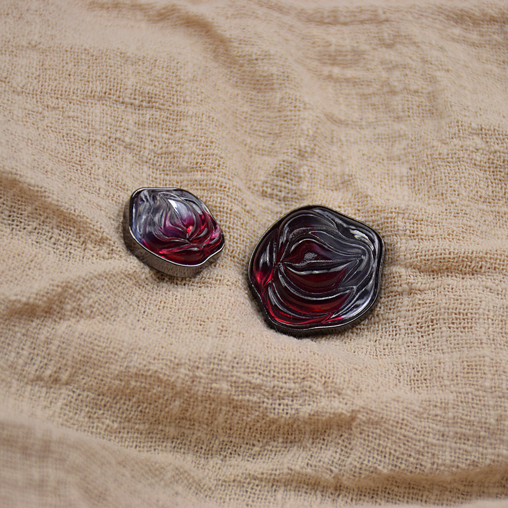 Transparent floral resin buttons, dark resin with red marbling and metal backing