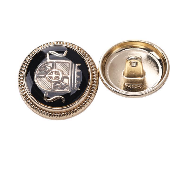Round crown enamel metal shank button, black enamel with gold-tone rim and crown detail