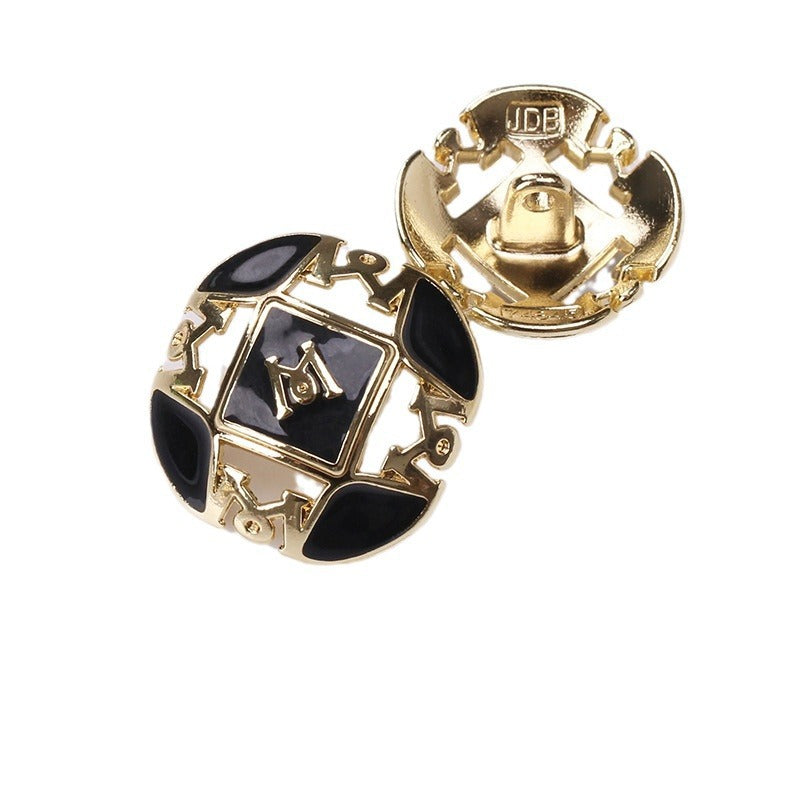 Letter M button pair, white & black enamel, gold metal 2-hole shank