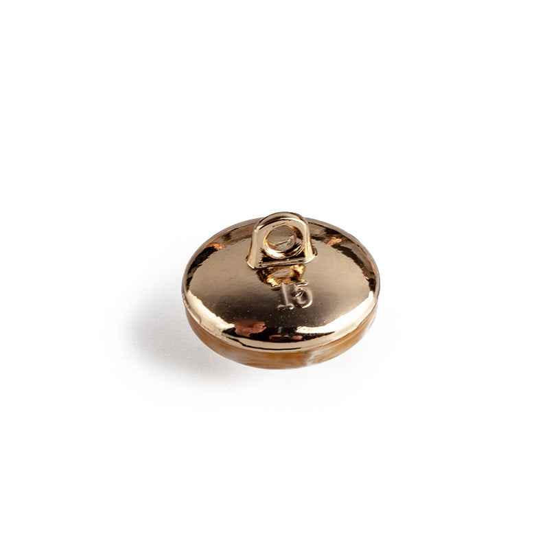 Round resin button back with metal backing and shank, gold tone