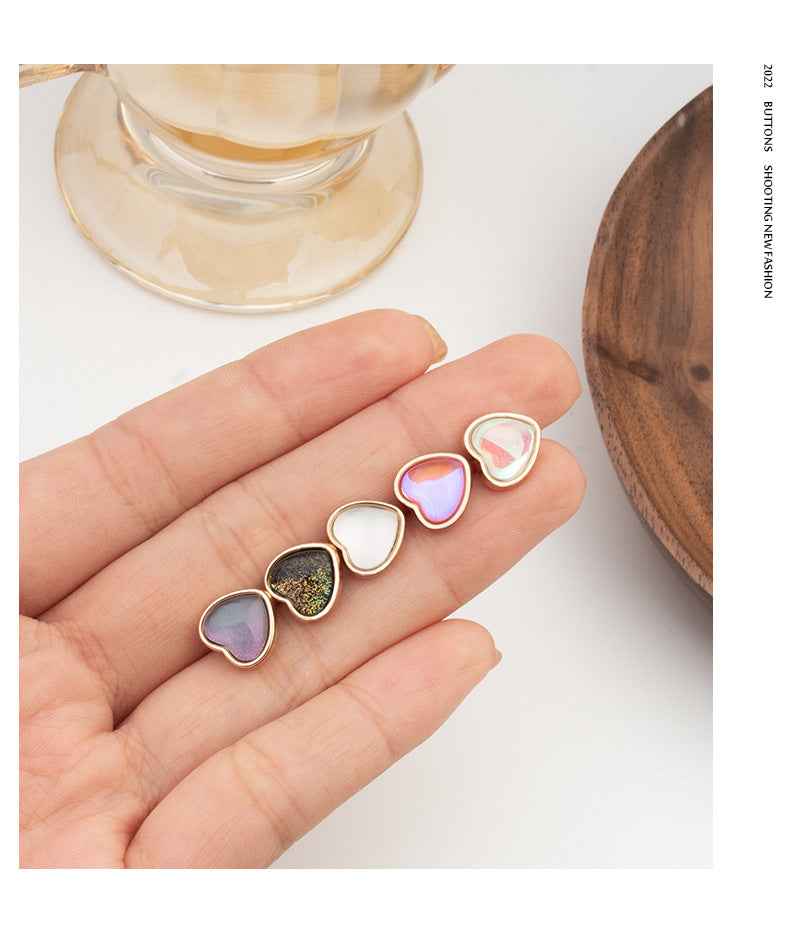 Heart-shaped buttons set, iridescent light panels with gold-tone edges, 5 shown in hand