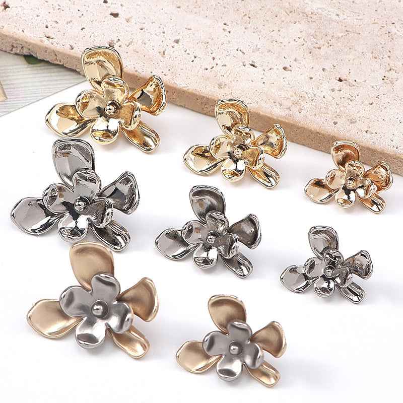 Mixed floral metal shank buttons: silver, gold, and bronze flowers with centers