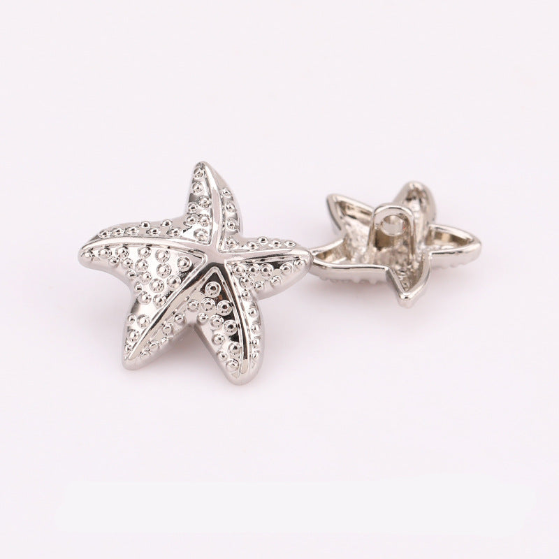 Nickel silver puffy starfish metal shank buttons, front and back views