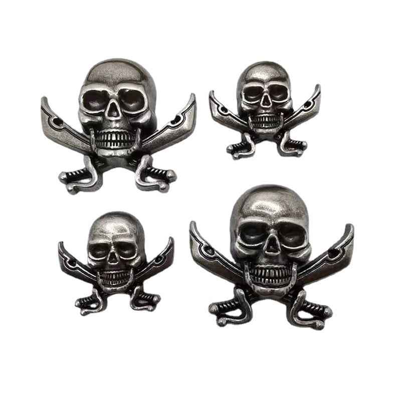 Metal skull rivet studs with dagger crossbones, silver-tone set of four
