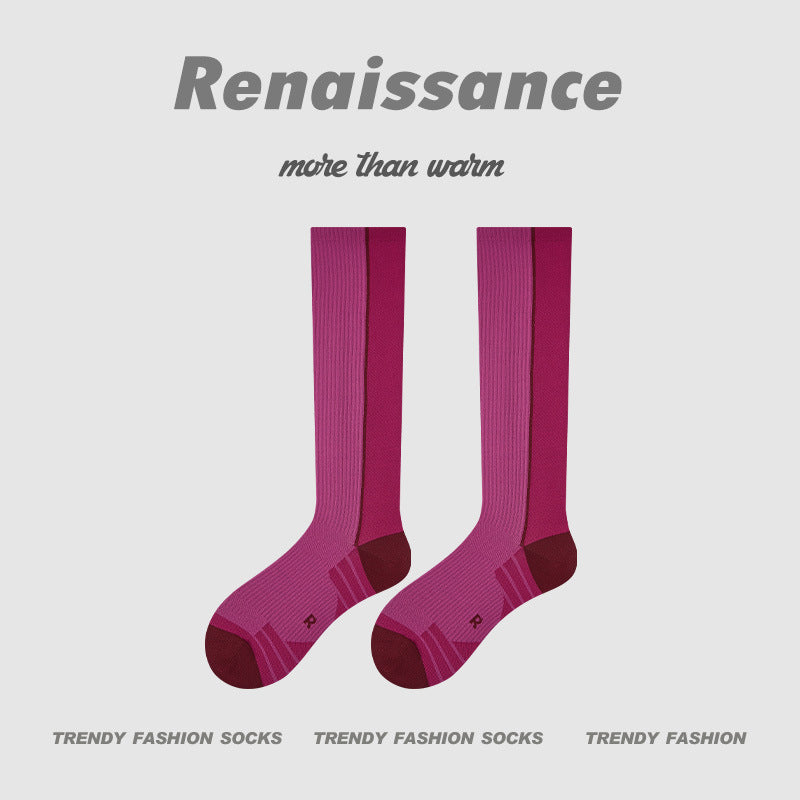 Magenta compression running socks with dark heel panel and striped rib texture