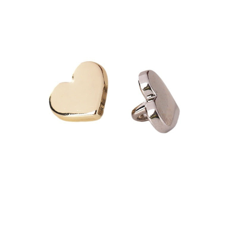 Heart-shaped metal shank buttons in light gold and nickel silver, front views
