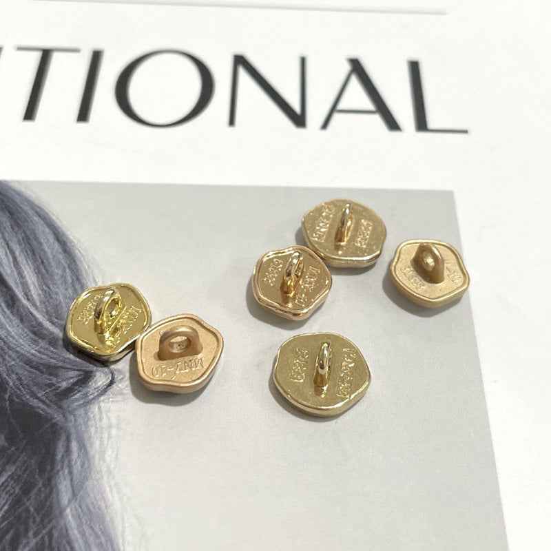 10mm metal shank buttons, gold backs with visible holes