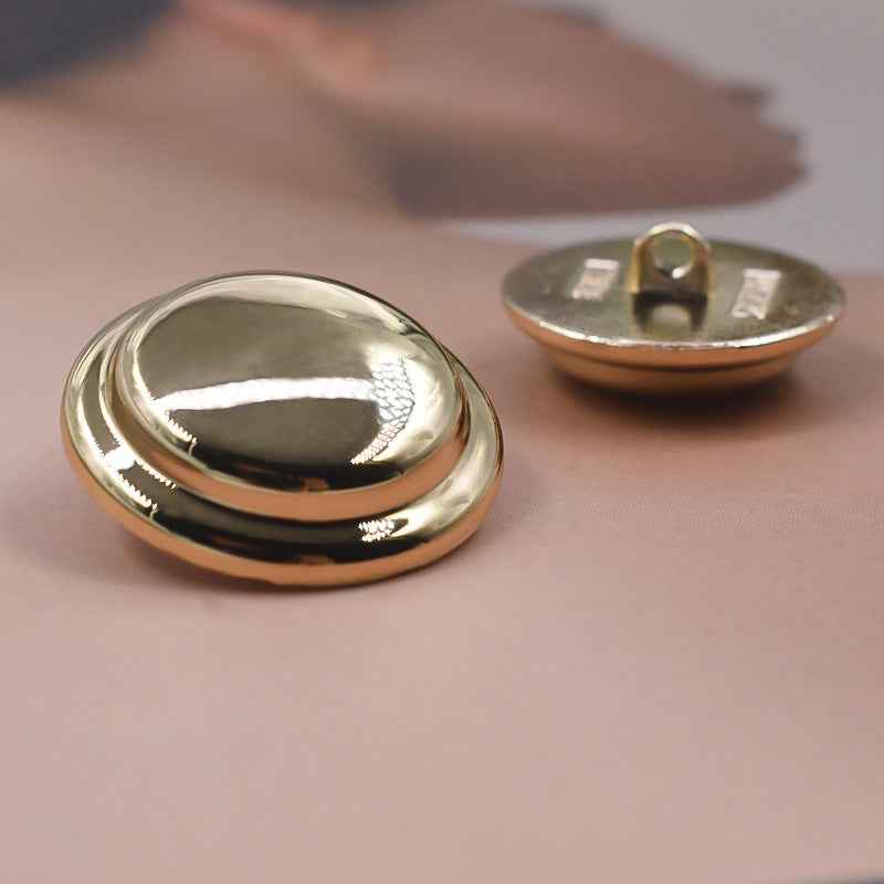 Solid gold metal shank button, round front with reflective dome face