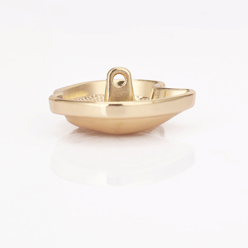 Paw-shaped metal shank button, light gold, side view with attachment loop