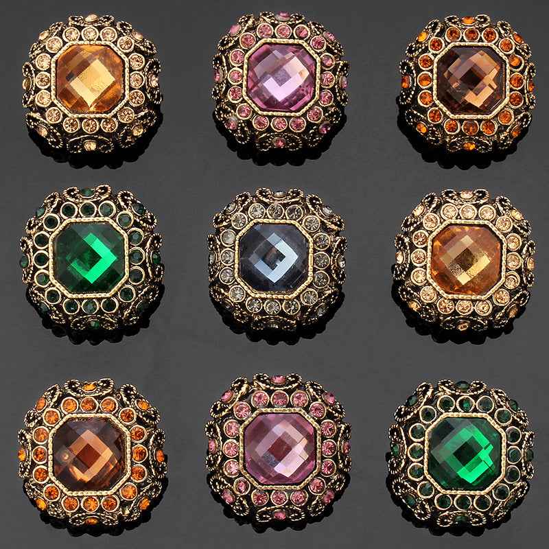 Rhinestone coat shank buttons, gold-tone frames with amber, pink, orange, green and blue-grey stones