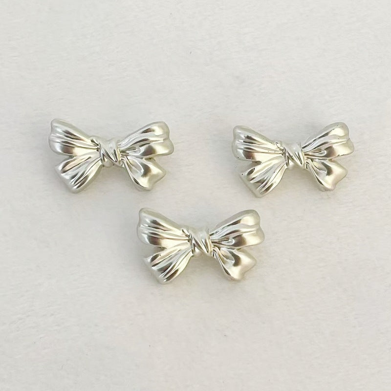 Matte silver bowknot metal shank buttons, hand-sew; three silver bow tops visible