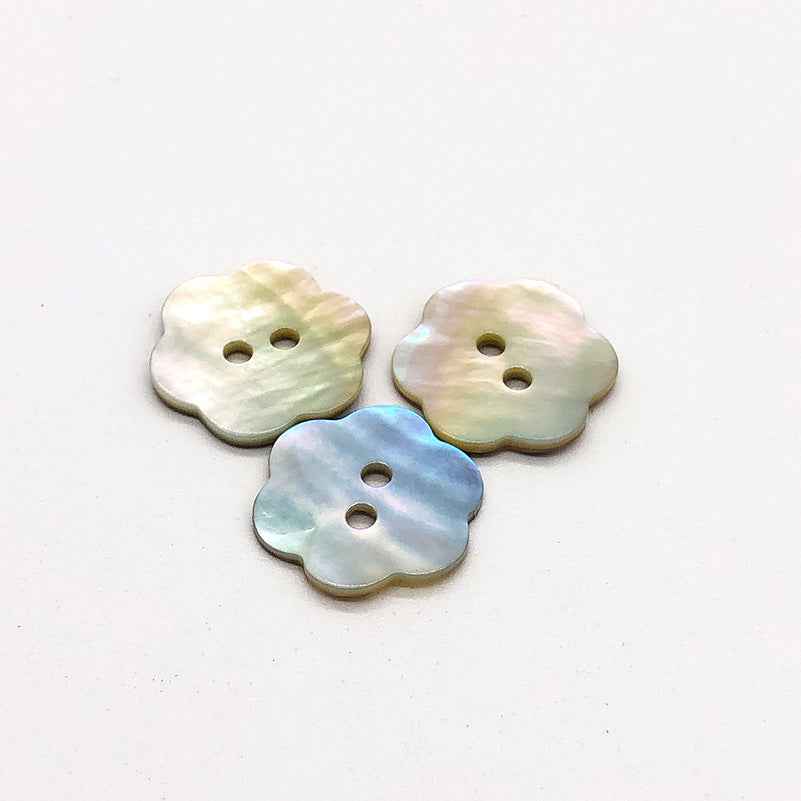 Plum blossom mother-of-pearl shell buttons with 2 holes (3 shown)