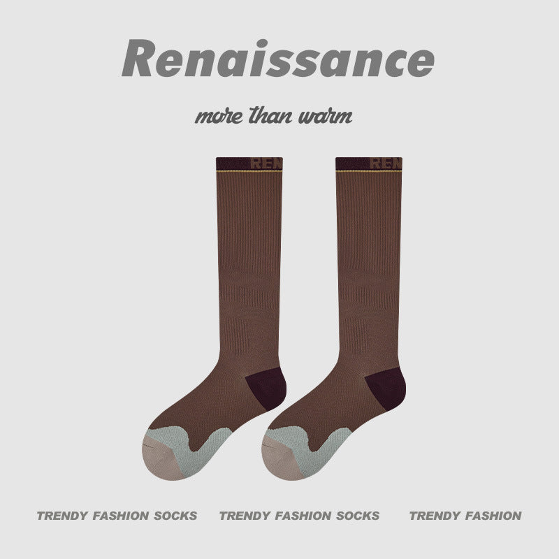 Brown compression running socks with gray toe and maroon heel accents, women’s crew