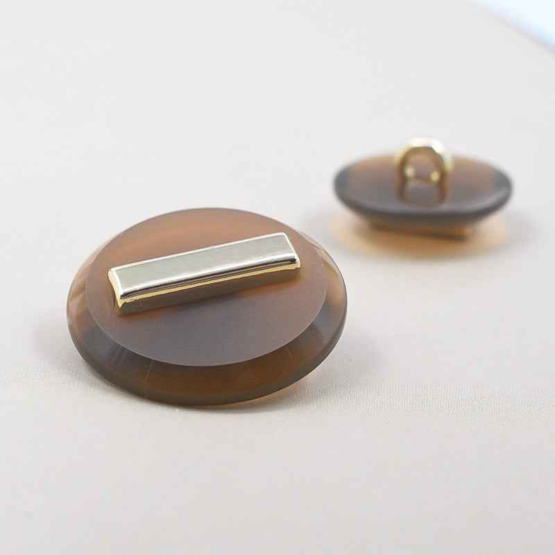 23/25mm brown resin metal shank button with gold rectangular bar