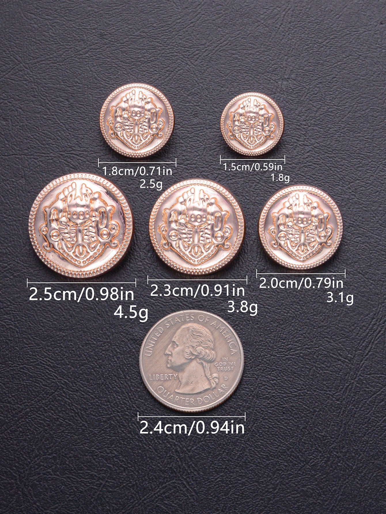 Rose-gold embossed decorative shank buttons with ornate crest design, mixed sizes.