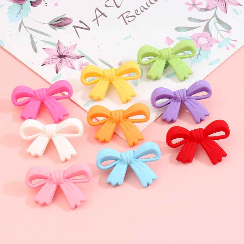 Bow-shaped plastic shank buttons, assorted colors: pink, yellow, green, purple, red, blue
