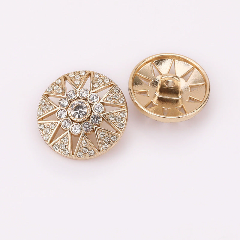 Hollow star crystal metal shank button, antique gold tone, front with sunburst pattern.