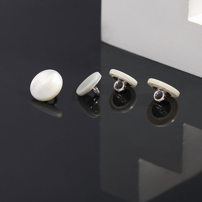 White shell shank button set, front and back views, round pearl-finish faces