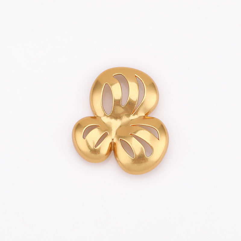 Gold-tone hollow flower metal shank button, front view with cutout petals