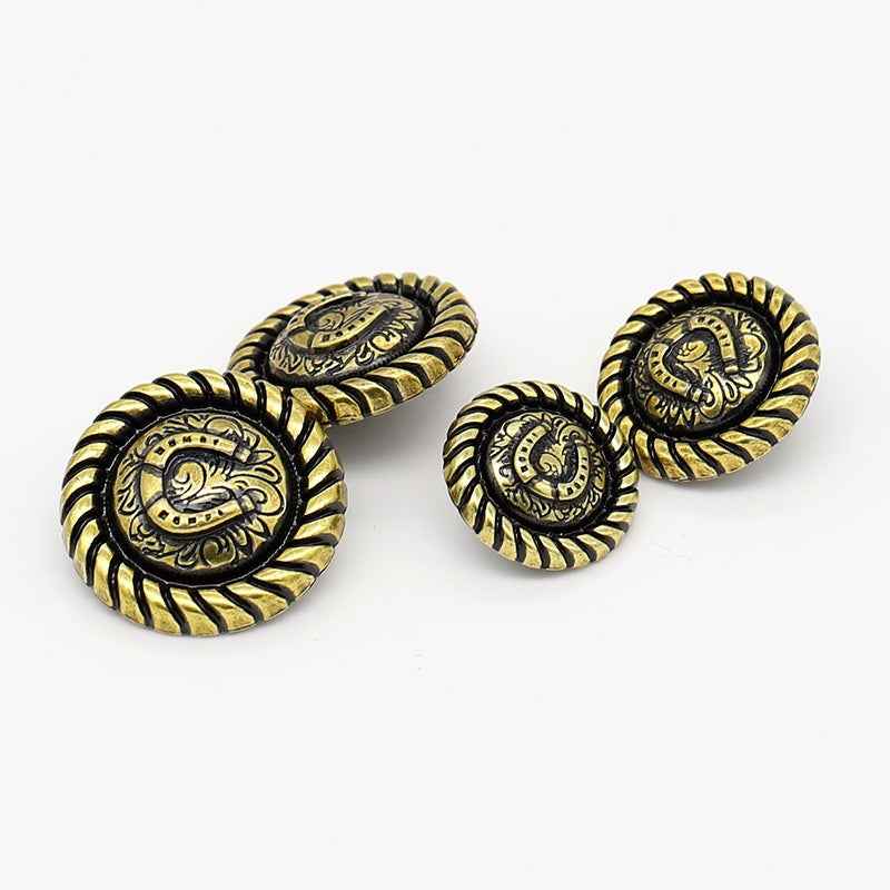 Antique gold metal shank buttons, horseshoe relief; front and back view