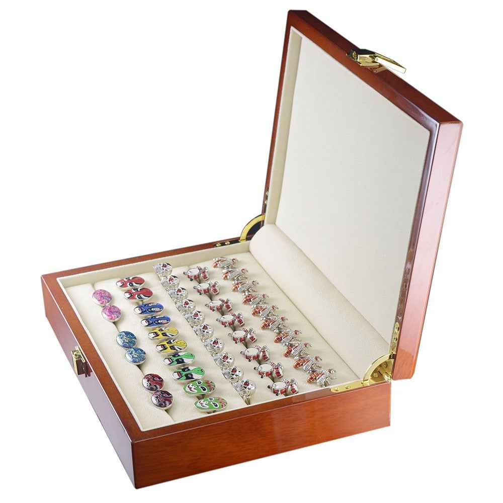 Open wooden cufflink display box with beige trays, showcasing colorful cufflinks