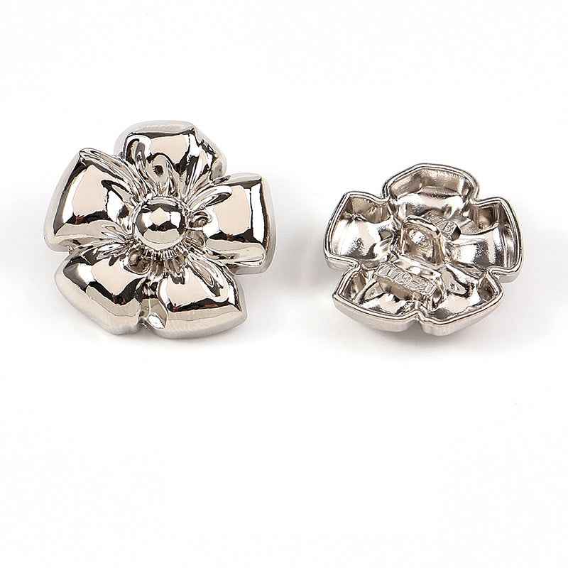 Silver floral metal shank button set, front and back view with raised flower detail