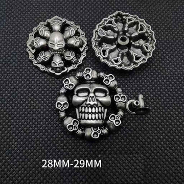 Skull rivet studs, silver-tone with skull faces and spikes; size 28–29 mm