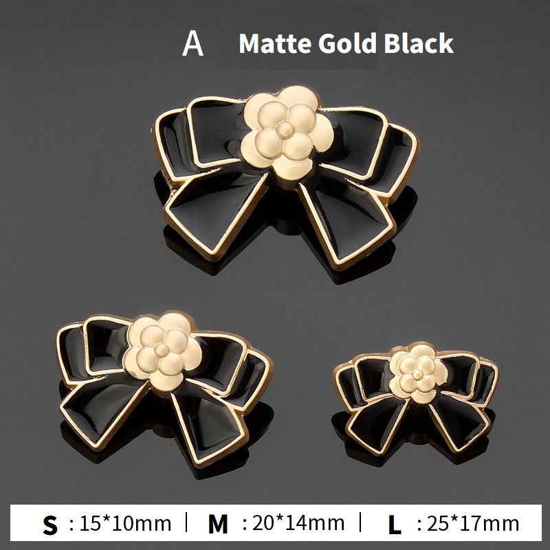 Style A bow buttons: gold and black enamel flower center, 3 sizes shown