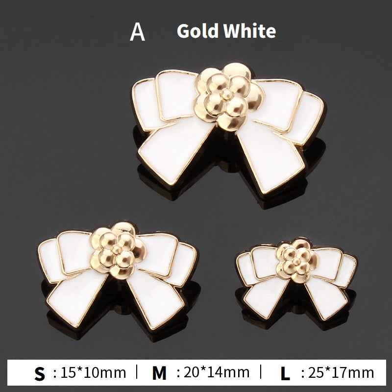 Style A bow buttons: gold and white enamel flower center, 3 sizes shown