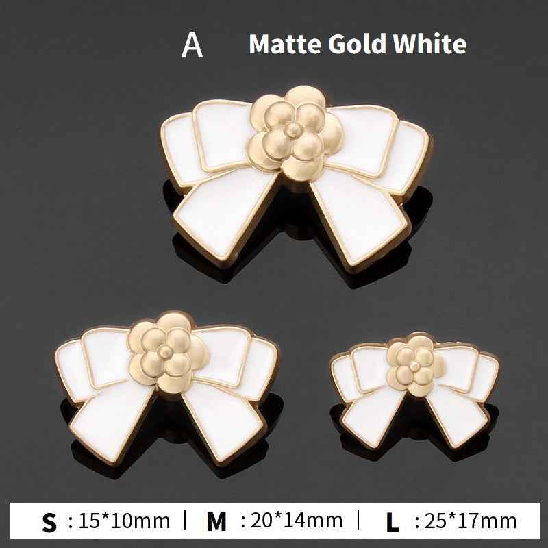 Style A bow buttons: matte gold and white enamel flower center, 3 sizes shown