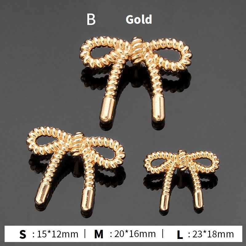 Style B stick buttons: gold ribbed loops with gold stems, 3 sizes shown