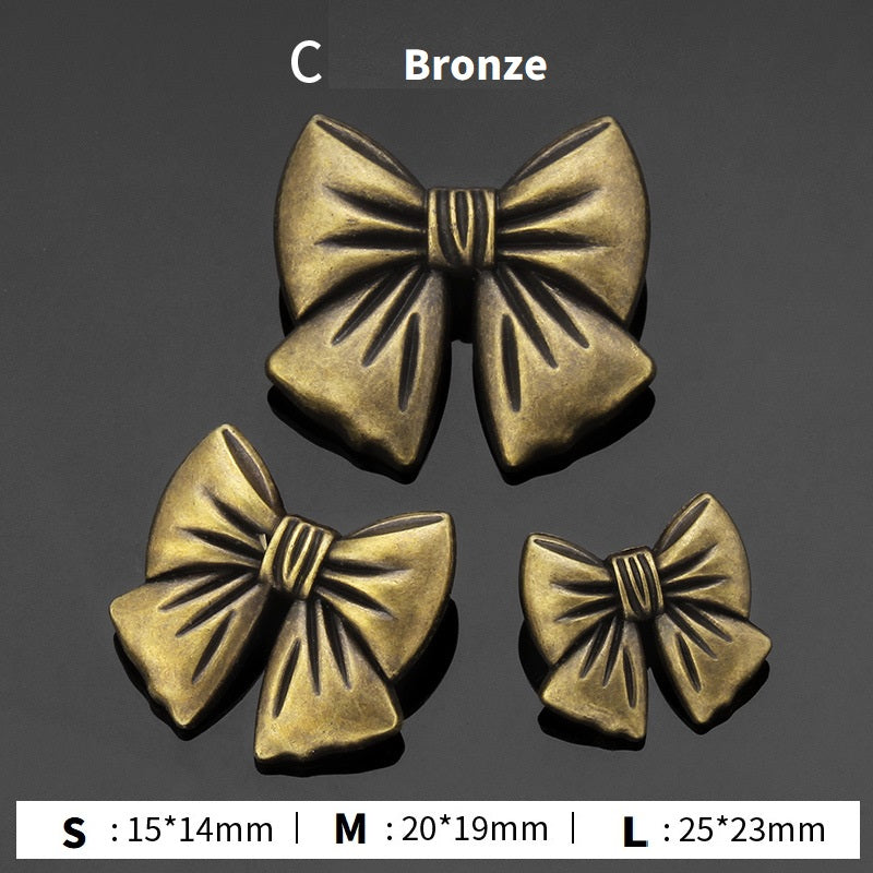 Bronze bow tie metal buttons, three sizes (S/M/L) with pleated ribbon center