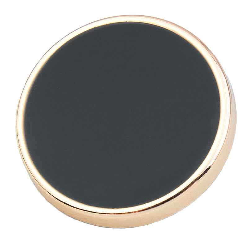 Close-up round alloy shank button, dark black face with gold-tone edge