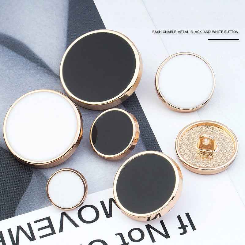 Set of round alloy shank buttons in white and black with gold-tone rims