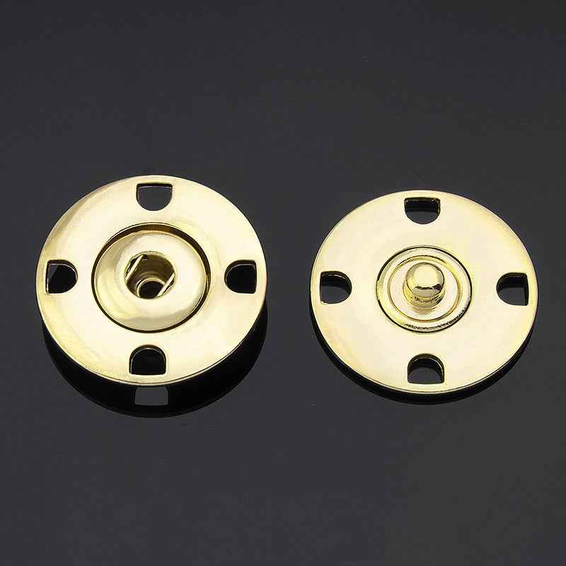 Gold metal hidden snap buttons, round disc with 4 notches and center snap posts