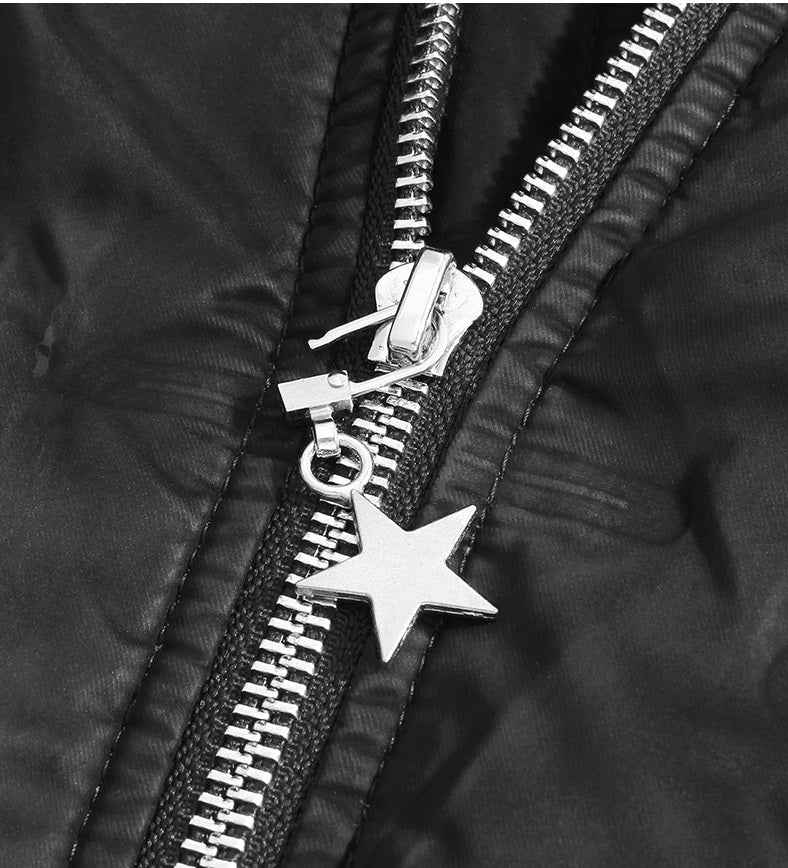 Zipper pull with detachable star charm, metal slider, black clip, dark garment with zipper