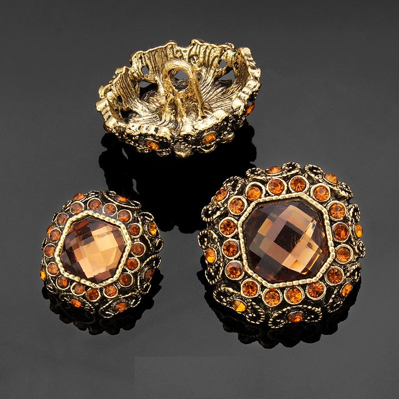 Rhinestone coat shank buttons with orange faceted centers, gold-tone rhinestone border and backs