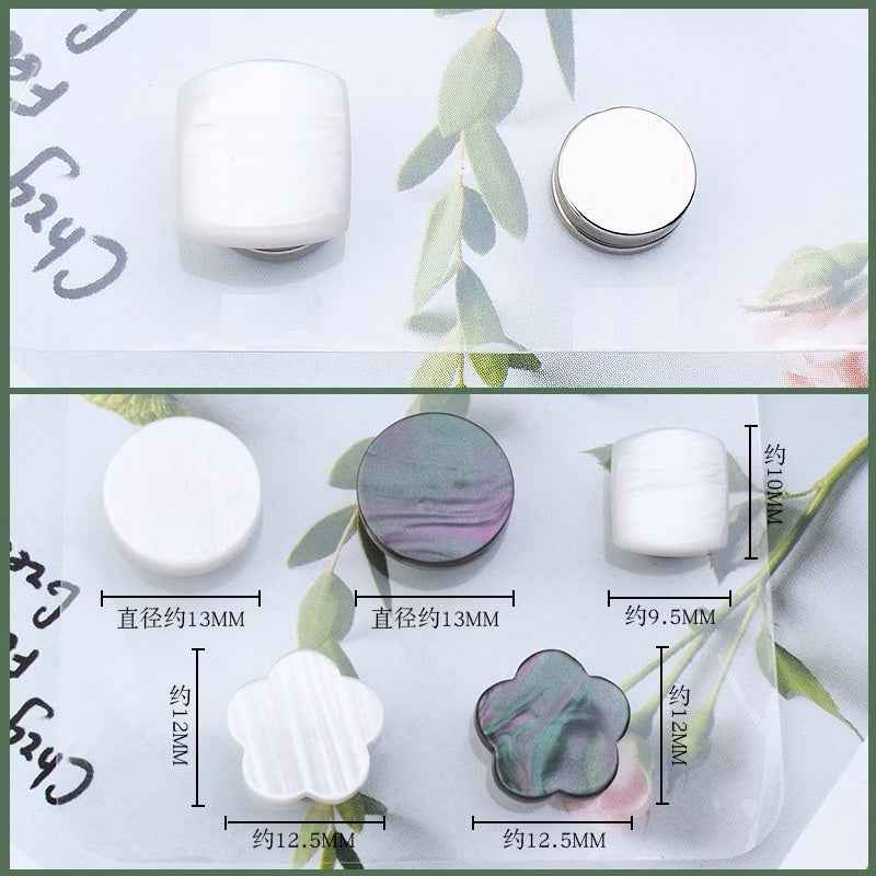 Shirt collar magnetic clips, clover shapes shown in white and dark gray with sizes