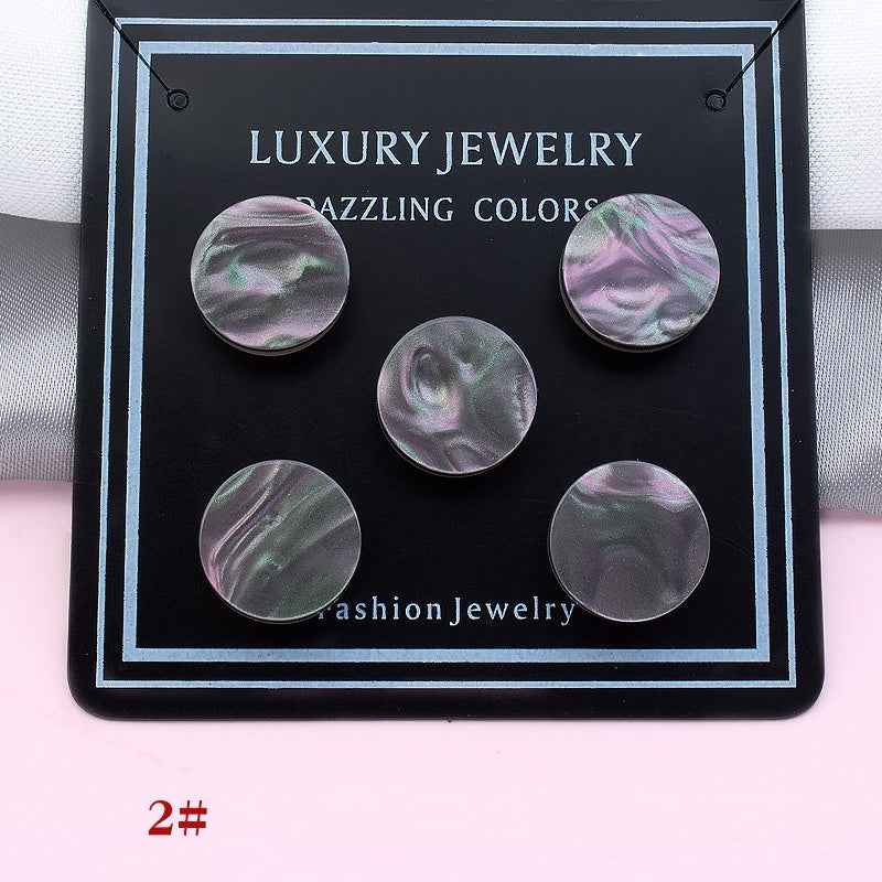 Iridescent clover magnetic collar clips in gray-violet-green tones, five pieces shown