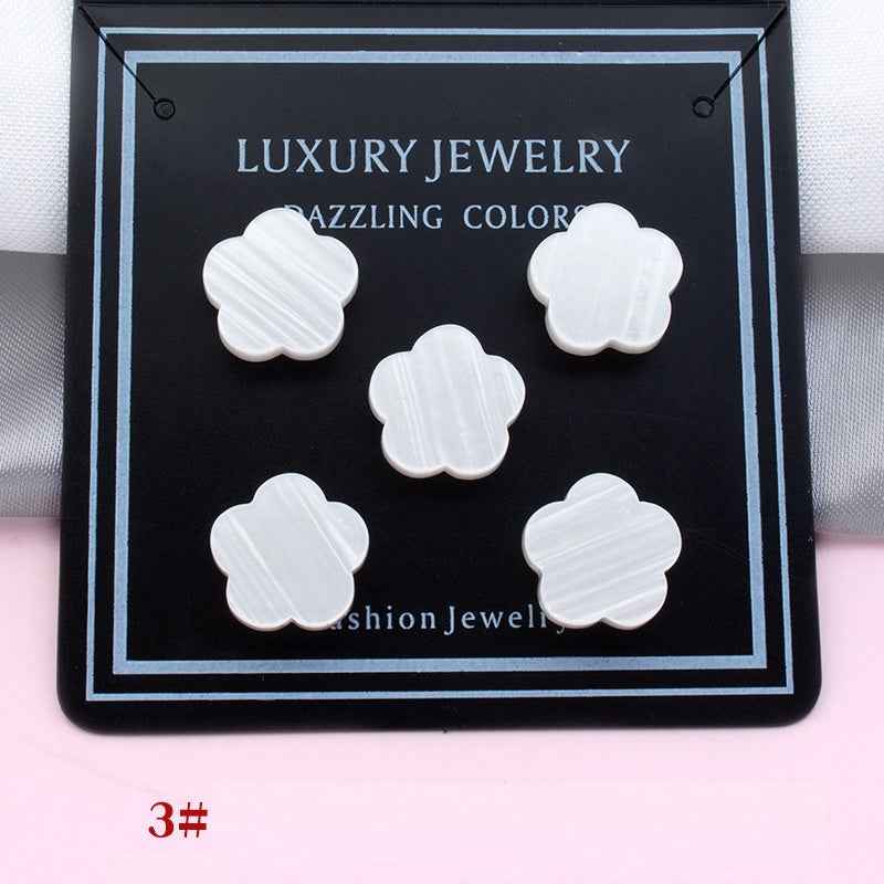 All-white clover magnetic collar clips on a display card, five pieces