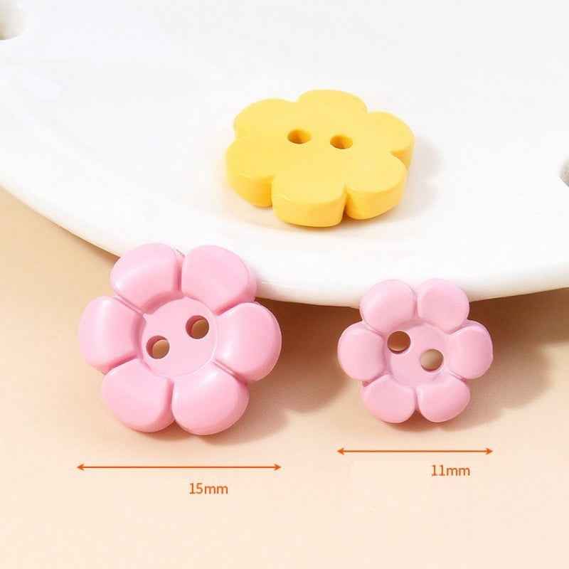 Pink and yellow flower 2-hole plastic buttons with size marks: 15mm and 11mm