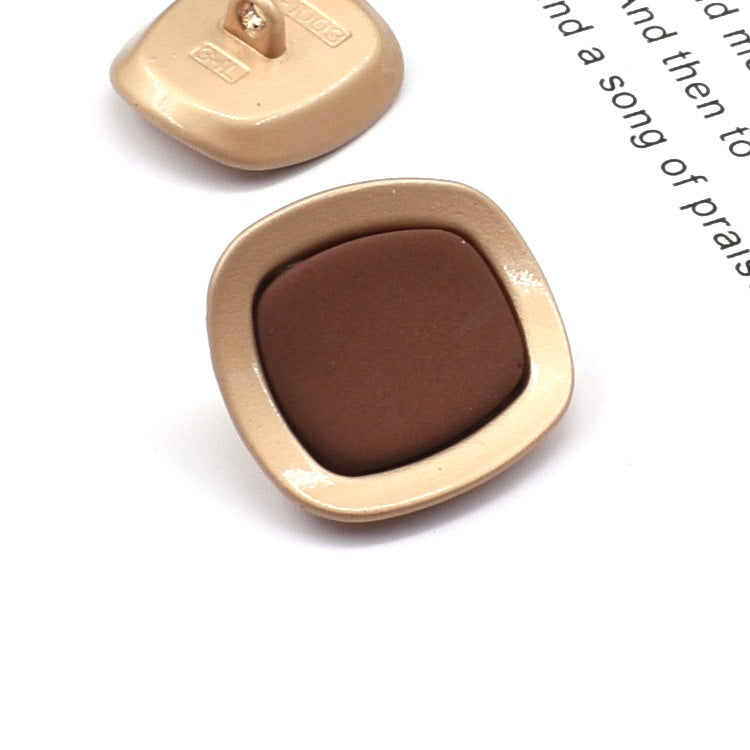 Square concave metal shank button, coffee brown front with gold-tone frame