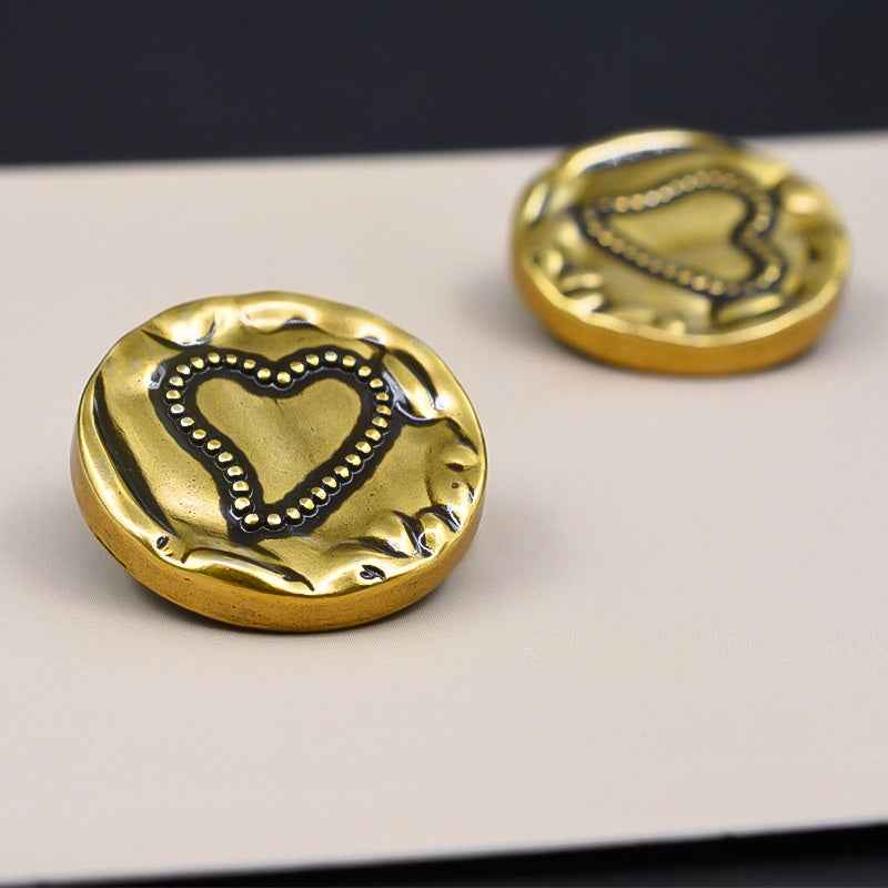 Gold metal shank button face with vintage heart in dotted border and swirl accents