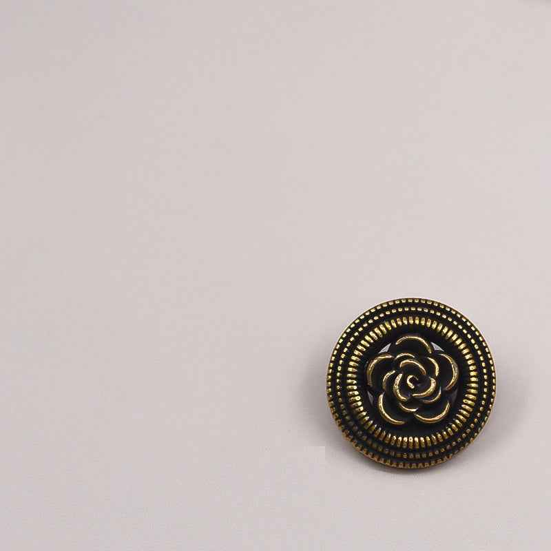 Vintage gold hollow rose metal button, black base with ornate beaded outer border