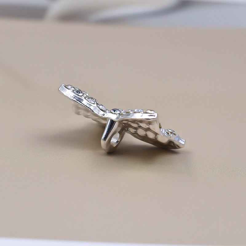 Silver rhinestone bow shank button with crystal-like stones, sparkling front view