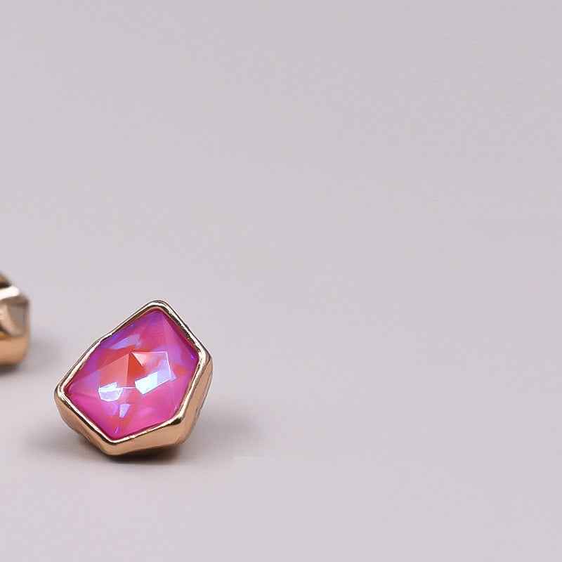 Irregular rhinestone button with hot pink faceted stone in gold-tone setting