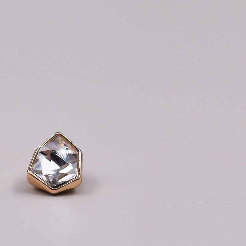 Irregular rhinestone button with clear faceted stone in gold-tone metal frame