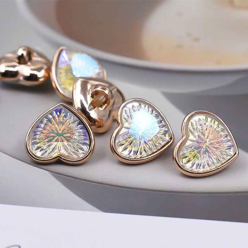 Heart-shaped iridescent glass shank buttons with gold-toned edges and rainbow facets