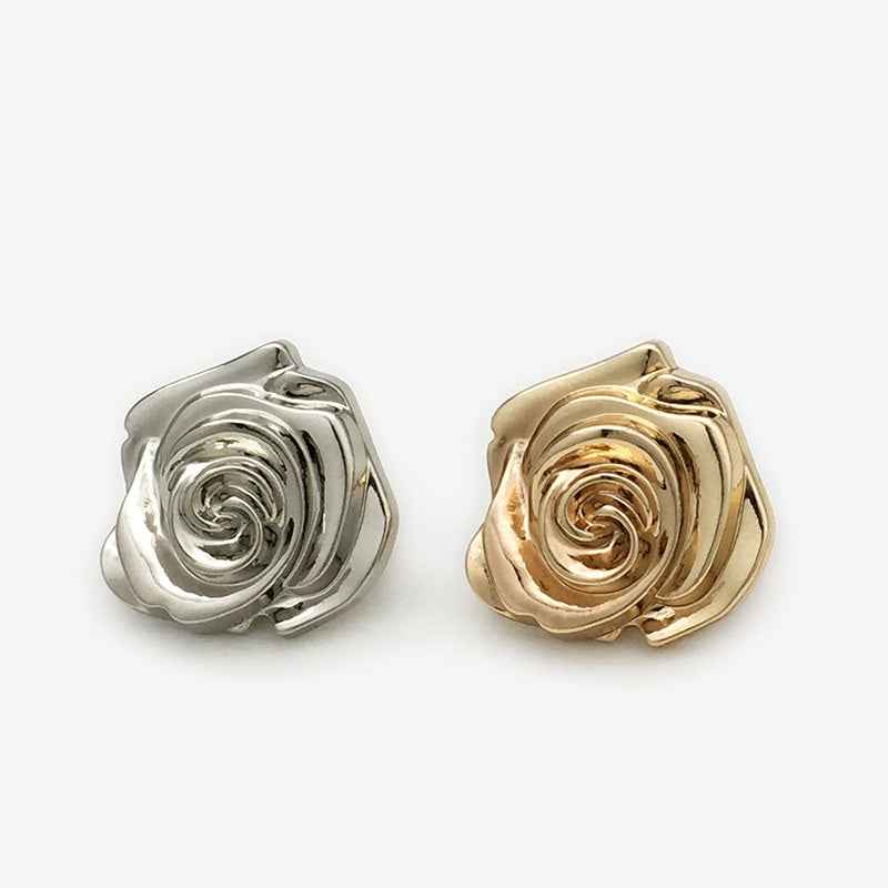 Silver and gold rose flower metal buttons, angled view with swirl centers