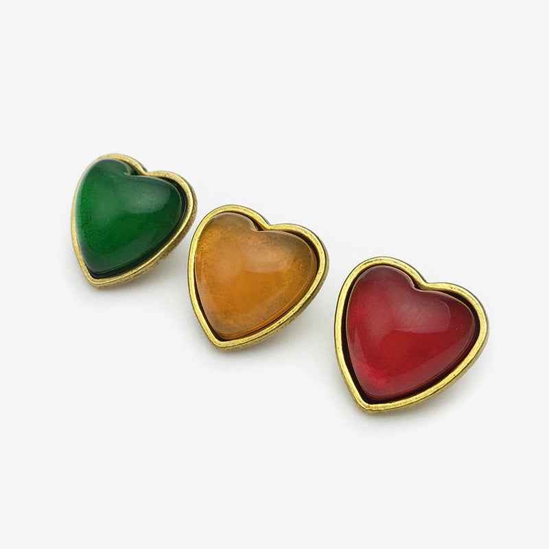 Heart buttons in green, amber, and red, gold-tone borders (fronts)